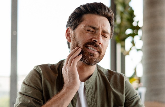 Man dealing with mouth pain