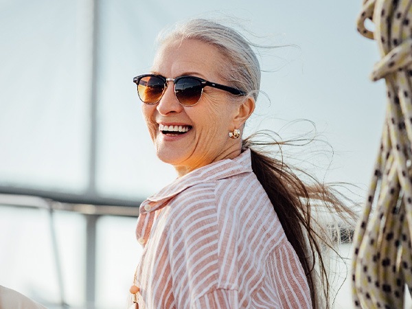 Older woman on a boat and smiling