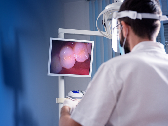 Dentist capturing close up photos of a patients teeth