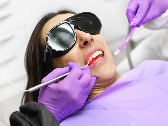 Dental patient having their gums treated with a soft tissue laser