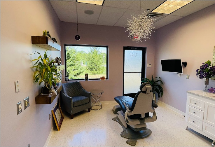 Dental exam room with a decorative fern